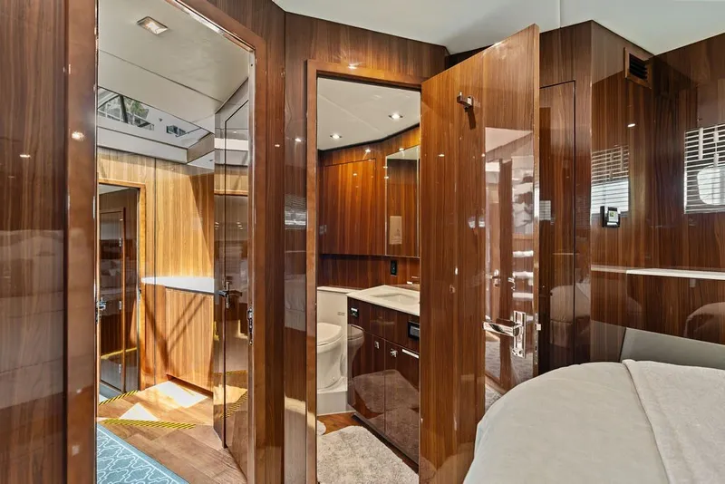 Slide: The Image of Luxurious interior of 2022 Cruisers Yachts 54 Cantius with polished wood finishes. - 65