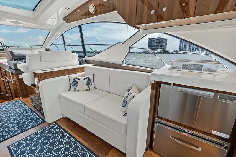 Slide: The Image of Luxurious interior of 2022 Cruisers Yachts 54 Cantius with elegant seating and modern amenities. - 43