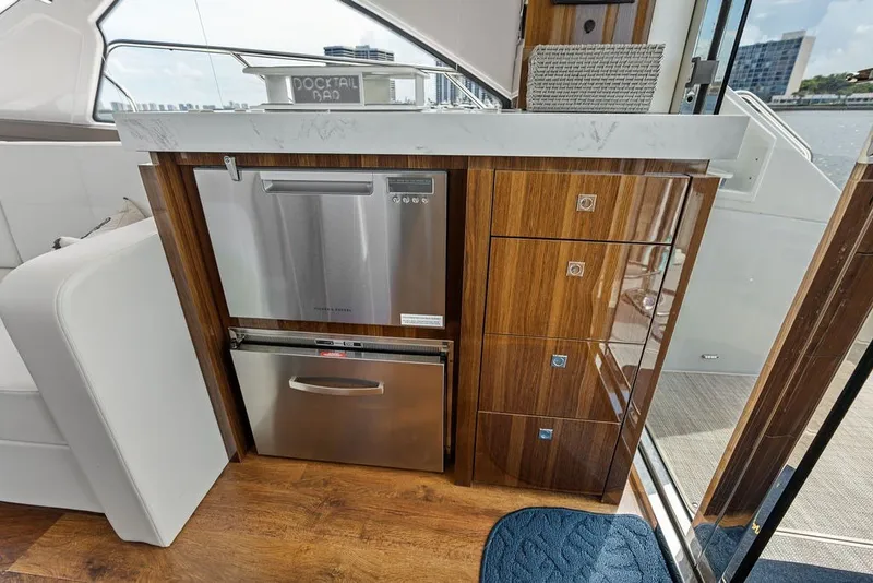 Slide: The Image of Luxurious interior of 2022 Cruisers Yachts 54 Cantius with modern kitchen appliances. - 42