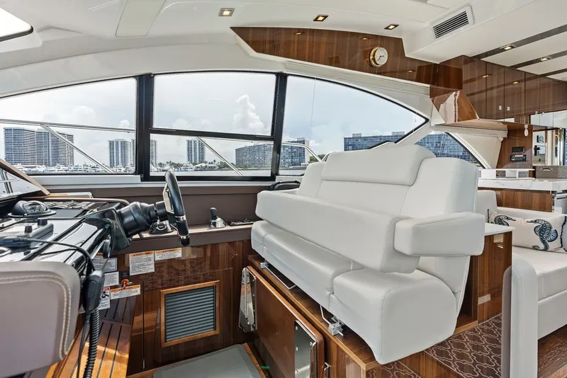 Slide: The Image of Luxurious interior of 2022 Cruisers Yachts 54 Cantius with modern helm and seating. - 49