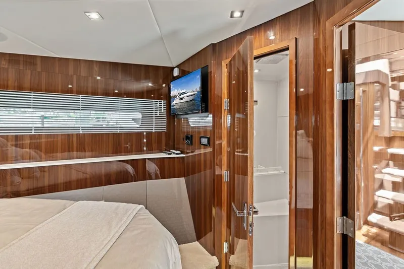 Slide: The Image of Luxurious interior of 2022 Cruisers Yachts 54 Cantius with wood paneling and modern amenities. - 64