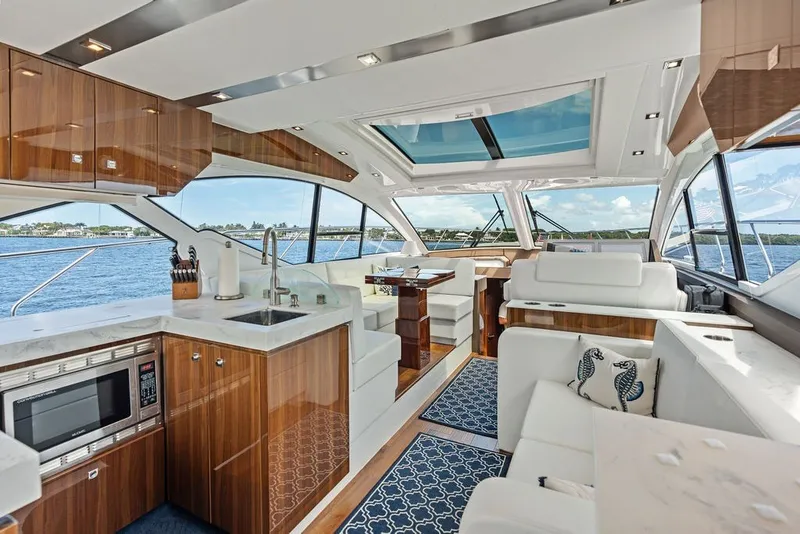 Slide: The Image of Luxurious interior of 2022 Cruisers Yachts 54 Cantius with modern kitchen and seating area. - 39
