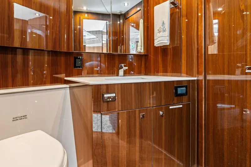 Slide: The Image of Luxurious bathroom in 2022 Cruisers Yachts 54 Cantius with wood finish and modern fixtures. - 66