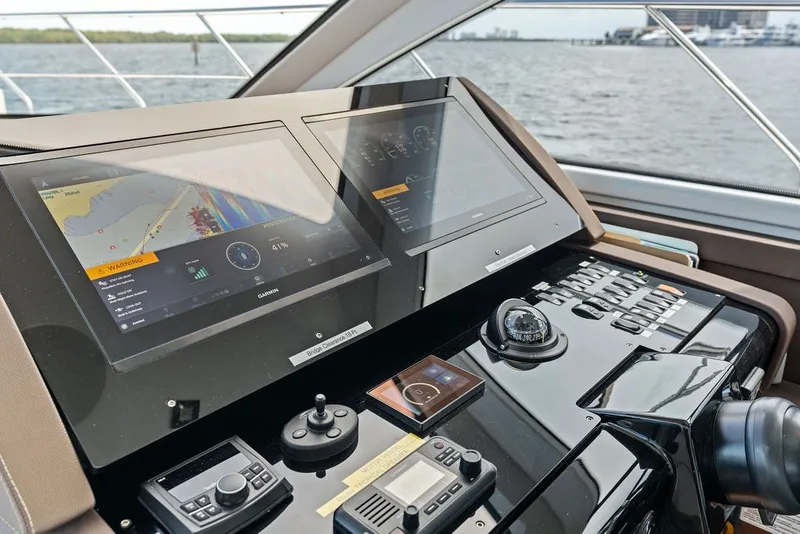 Slide: The Image of Helm of 2022 Cruisers Yachts 54 Cantius with advanced navigation displays. - 51