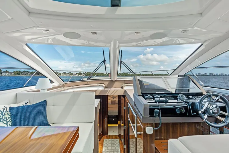 Slide: The Image of Luxurious interior of 2022 Cruisers Yachts 54 Cantius with modern helm and panoramic windows. - 48