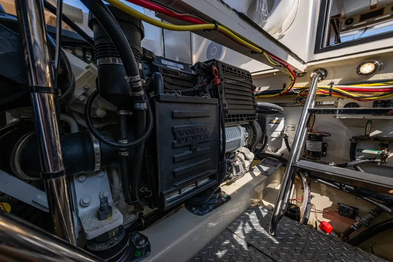 Slide: The Image of Engine room of 2020 Ranger Tugs R-41 CB, featuring Volvo Penta components and wiring. - 50