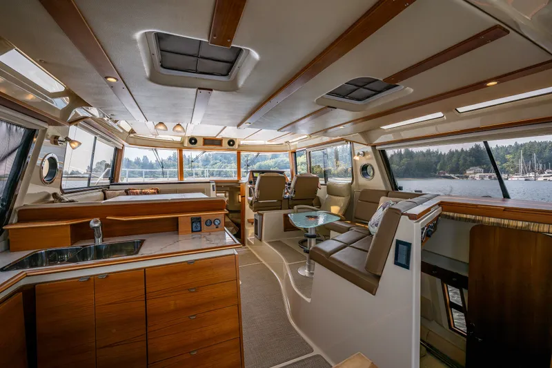 Slide: The Image of Luxurious interior of 2020 Ranger Tugs R-41 CB yacht with scenic water views. - 18