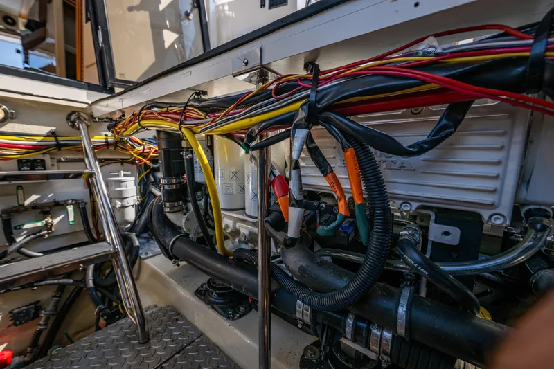 Slide: The Image of Engine compartment of 2020 Ranger Tugs R-41 CB with visible wiring and components. - 49