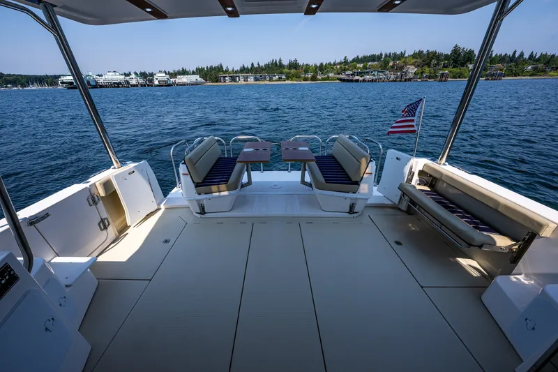 Slide: The Image of Spacious deck of 2020 Ranger Tugs R-41 CB yacht with seating and scenic water view. - 11