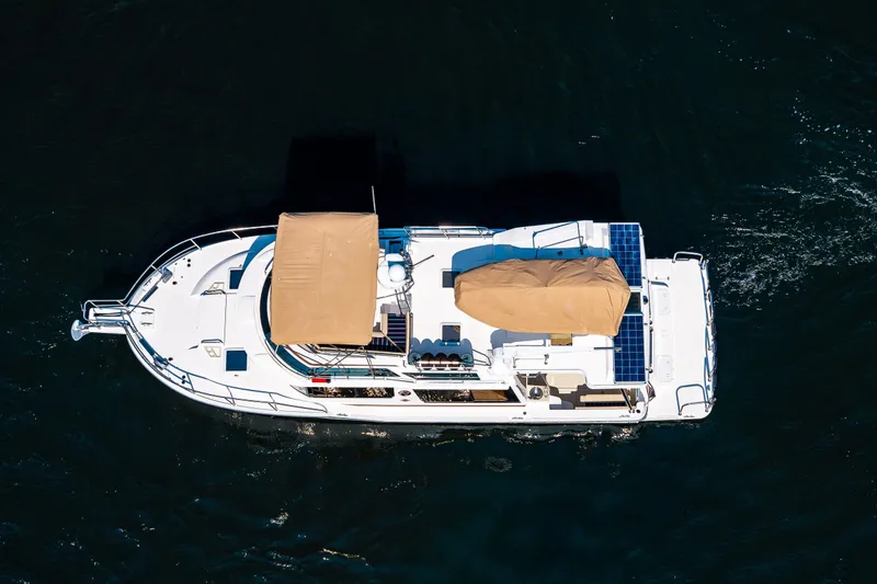 Slide: The Image of Aerial view of 2020 Ranger Tugs R-41 CB boat with solar panels on water. - 6