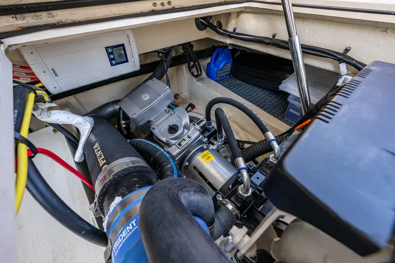 Slide: The Image of Engine compartment of 2020 Ranger Tugs R-41 CB with visible components and wiring. - 52
