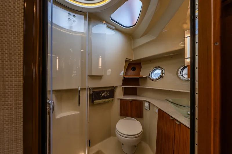 Slide: The Image of Luxurious bathroom in 2020 Ranger Tugs R-41 CB yacht with modern fixtures and porthole windows. - 35