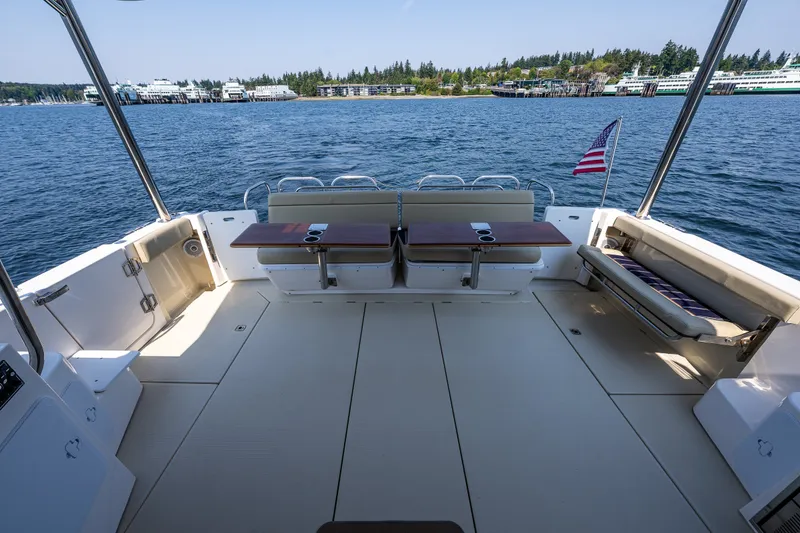 Slide: The Image of Spacious deck of 2020 Ranger Tugs R-41 CB yacht with scenic waterfront view. - 10