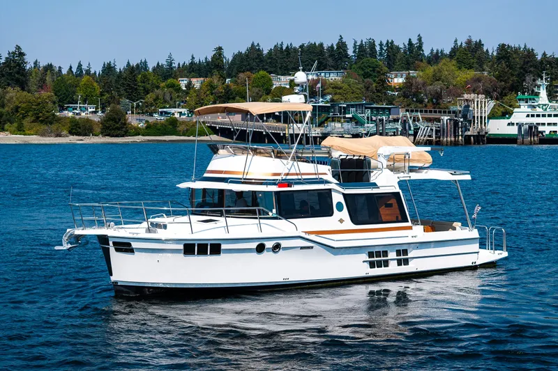 Slide: The Image of 2020 Ranger Tugs R-41 CB yacht cruising on a scenic waterway. - 5