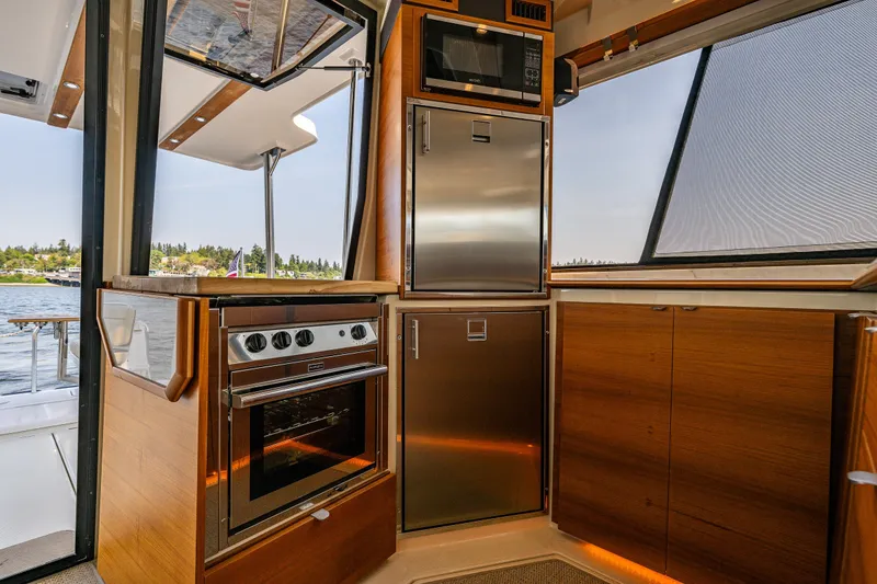 Slide: The Image of Modern kitchen interior of 2020 Ranger Tugs R-41 CB yacht with stainless steel appliances. - 20