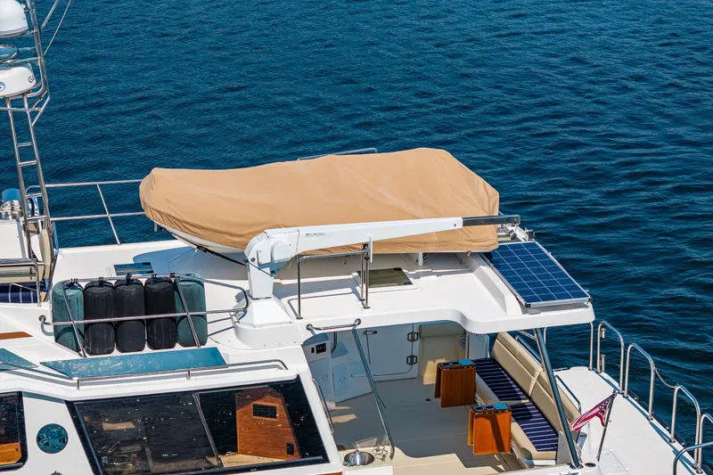 Slide: The Image of 2020 Ranger Tugs R-41 CB yacht with solar panels and covered equipment on deck. - 7