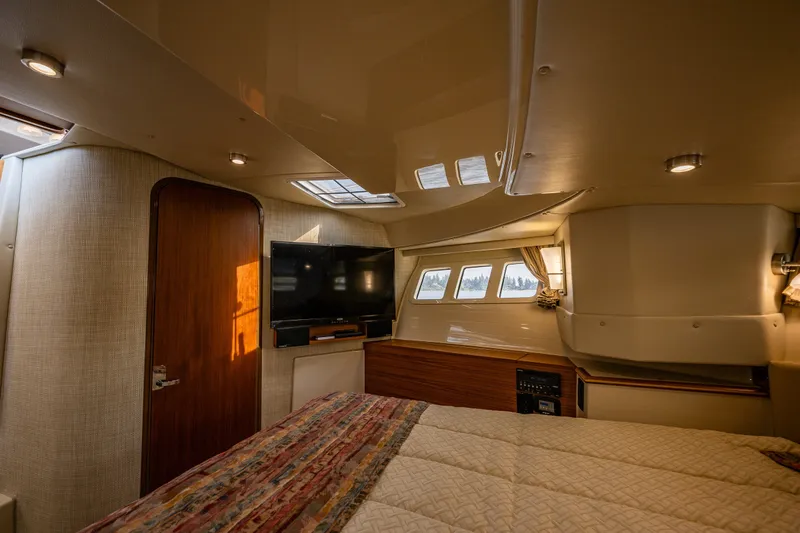 Slide: The Image of Luxurious interior of 2020 Ranger Tugs R-41 CB with cozy bedroom and modern amenities. - 31