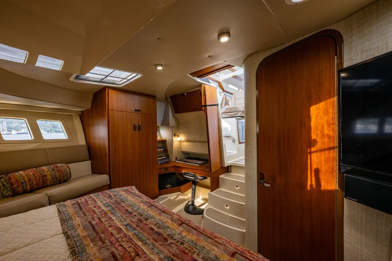 Slide: The Image of Luxurious interior of 2020 Ranger Tugs R-41 CB yacht with wood finishes and cozy seating. - 34