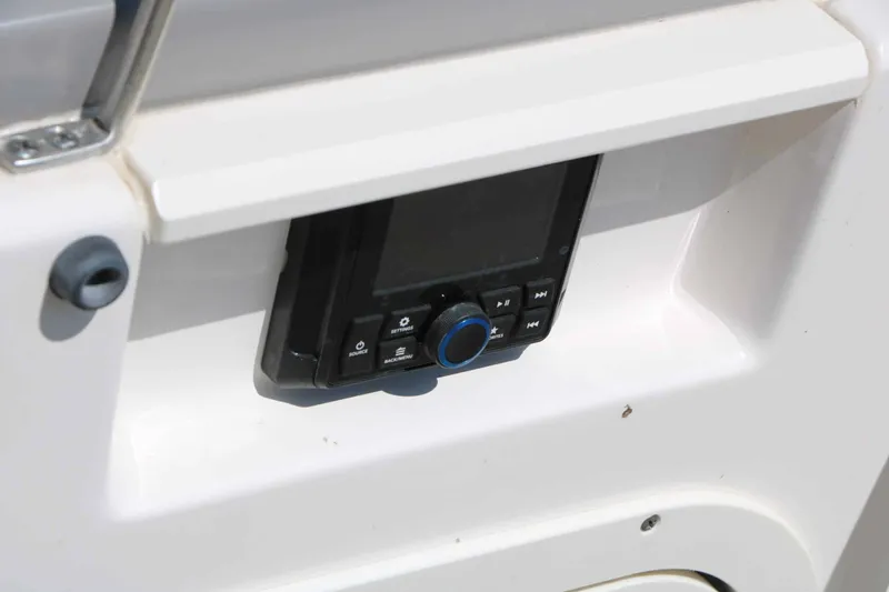 Slide: The Image of A control unit is embedded in the white console of a 2023 Chaparral 23 SSi. - 49