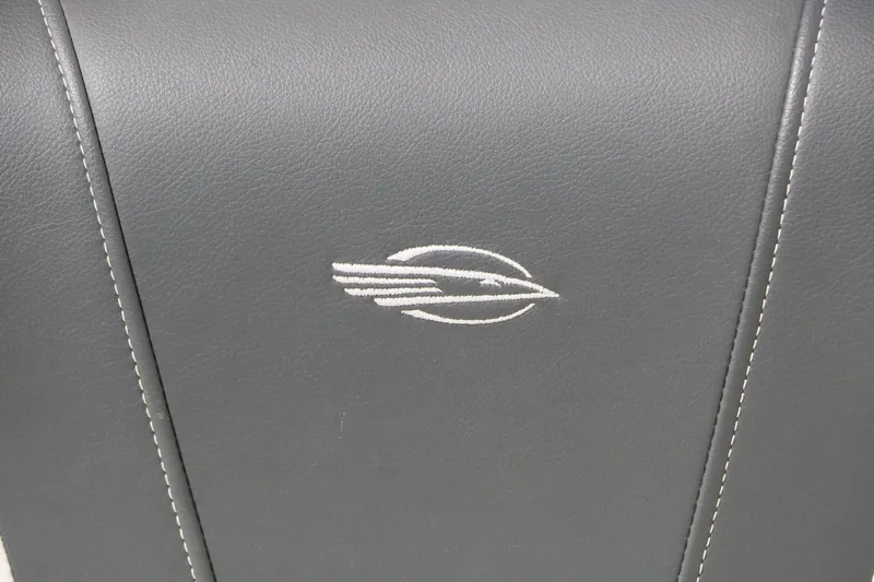 Slide: The Image of Close-up of a gray seat with an embroidered logo. - 45