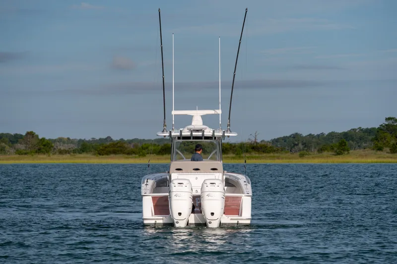 Slide: The Image of Valhalla V-33 boat on water, rear view, 2021 model, with dual engines. - 45