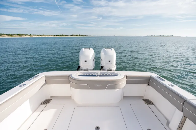 Slide: The Image of 2021 Valhalla V-33 boat with dual engines on open water. - 12
