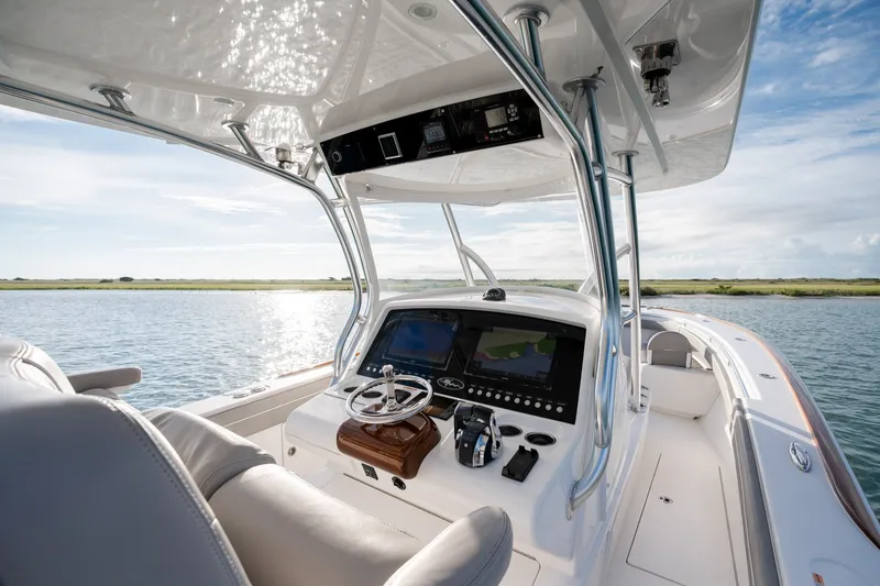 Slide: The Image of Valhalla V-33 2021 boat cockpit with modern navigation system on calm water. - 21