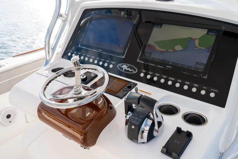 Slide: The Image of Valhalla V-33 2021 boat helm with advanced navigation displays and controls. - 22