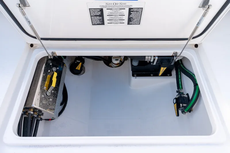 Slide: The Image of Valhalla V-33 2021 boat compartment with mechanical components and wiring. - 33