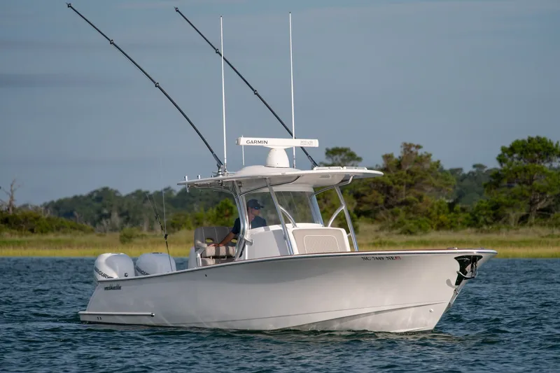 Slide: The Image of 2021 Valhalla V-33 boat on water with fishing rods and Garmin equipment. - 43