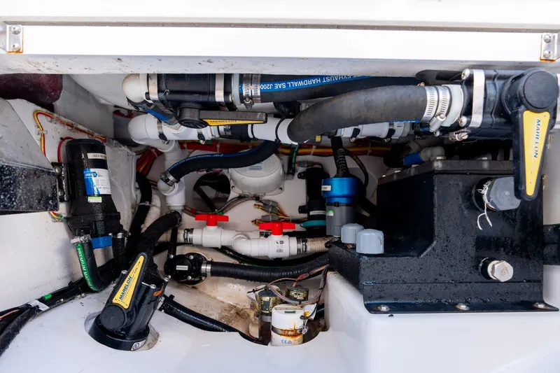Slide: The Image of Engine compartment of 2021 Valhalla V-33 boat with hoses and mechanical components. - 34