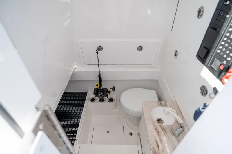 Slide: The Image of 2021 Valhalla V-33 boat interior with compact bathroom and modern amenities. - 6