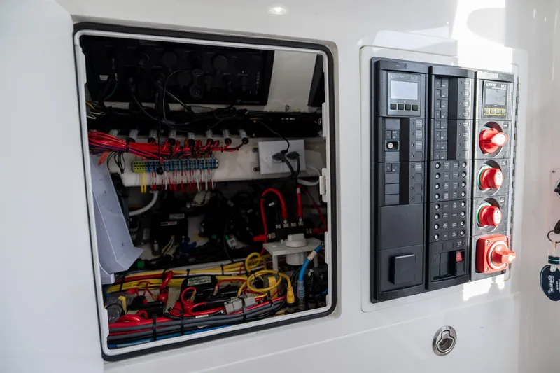 Slide: The Image of Electrical panel of 2021 Valhalla V-33 boat, showcasing wiring and control systems. - 7