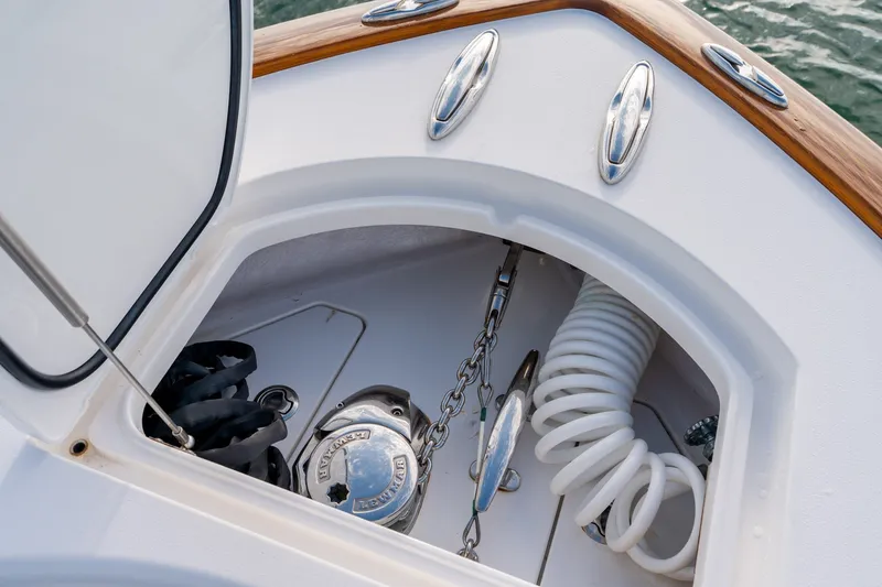Slide: The Image of Anchor compartment of 2021 Valhalla V-33 boat with coiled rope and chain. - 27