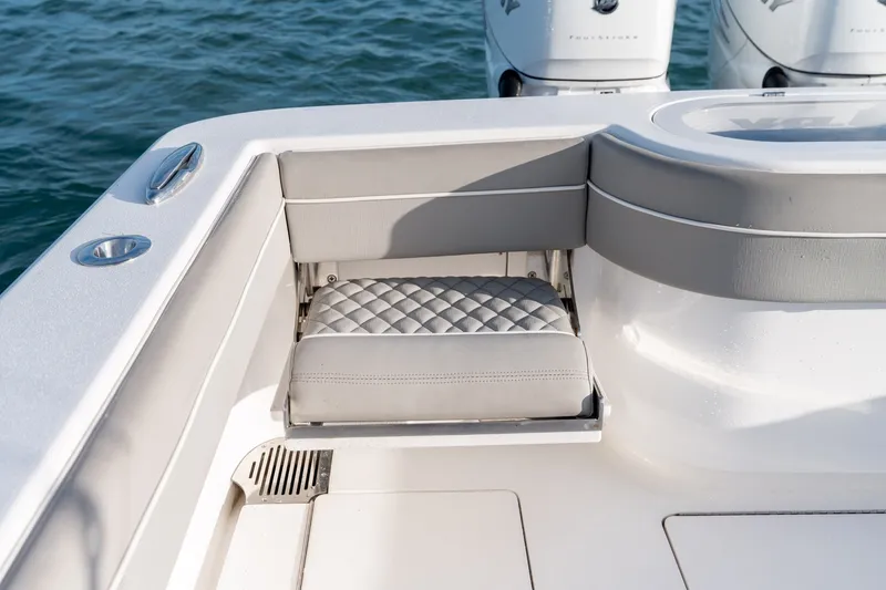 Slide: The Image of Valhalla V-33 2021 boat with cushioned seating and outboard motors on water. - 15