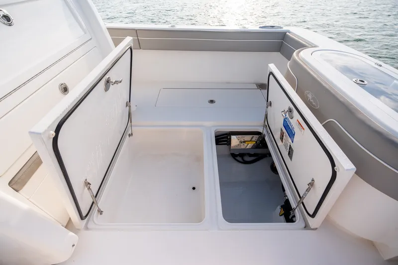 Slide: The Image of Open storage compartments on a 2021 Valhalla V-33 boat deck. - 32