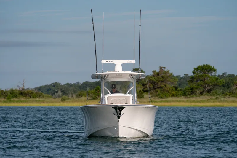 Slide: The Image of Front view of a 2021 Valhalla V-33 boat on calm water. - 3