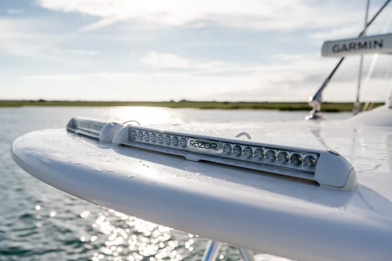 Slide: The Image of LED light bar on 2021 Valhalla V-33 boat, with water and sky background. - 40