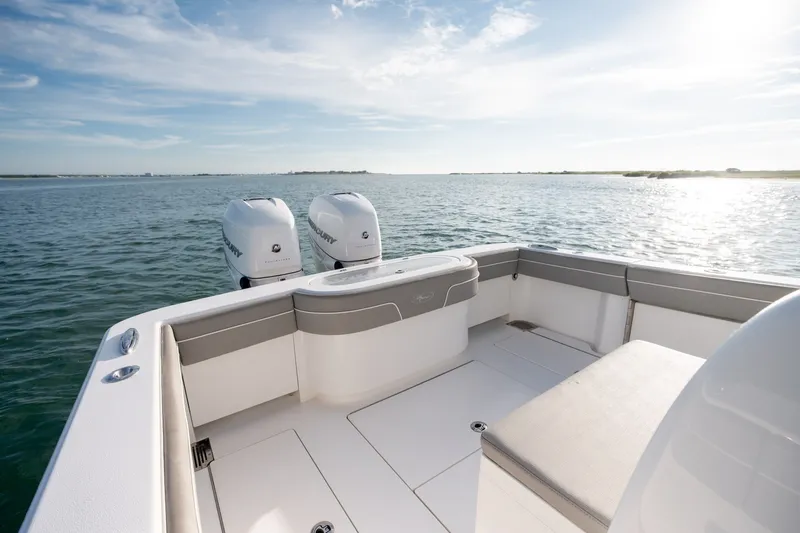 Slide: The Image of Valhalla V-33 boat deck with twin engines, 2021 model, on calm water. - 11