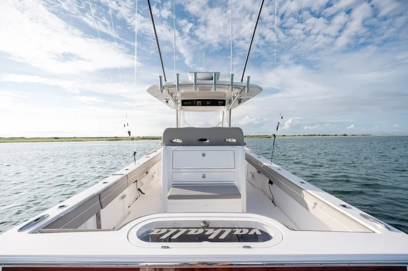 Slide: The Image of 2021 Valhalla V-33 boat on water under a clear sky. - 16