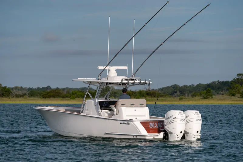 Slide: The Image of 2021 Valhalla V-33 boat on water, equipped with dual Mercury 400 engines. - 46