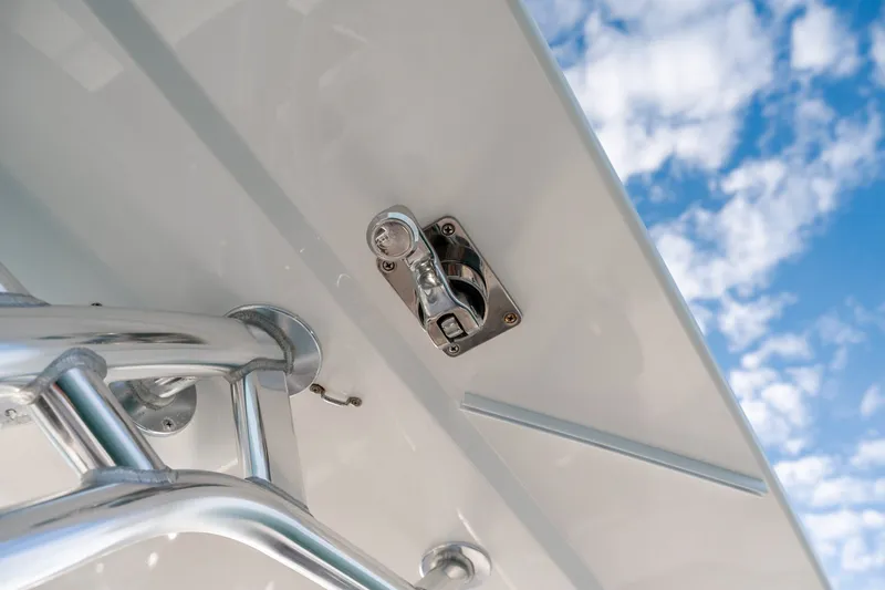 Slide: The Image of Close-up of 2021 Valhalla V-33 boat hardware against a blue sky with clouds. - 38