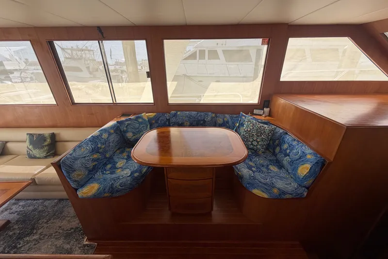 Slide: The Image of Luxurious 2002 Seahorse 45 MY yacht interior with elegant dining area and vibrant seating. - 18
