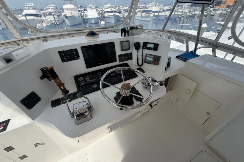 Slide: The Image of Cockpit of 2002 Seahorse 45 MY yacht with steering wheel and navigation equipment. - 12