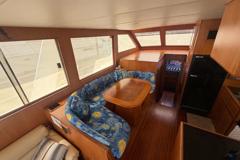 Slide: The Image of Interior of 2002 Seahorse 45 MY yacht with cozy seating and wooden finishes. - 17
