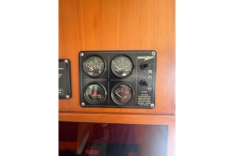 Slide: The Image of Control panel of a 2002 Seahorse 45 MY boat with gauges and switches. - 26