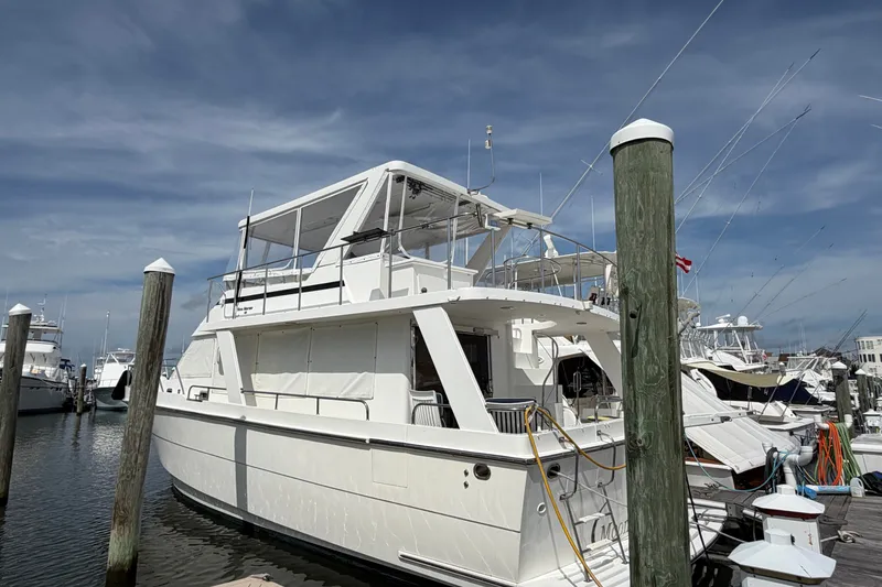 Slide: The Image of 2002 Seahorse 45 MY yacht docked at marina under clear blue sky. - 1