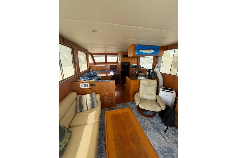 Slide: The Image of Interior of 2002 Seahorse 45 MY yacht with cozy seating and modern amenities. - 16