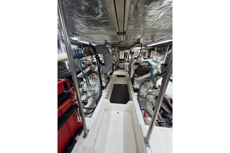 Slide: The Image of Engine room of a 2002 Seahorse 45 MY yacht, showcasing mechanical components and equipment. - 30