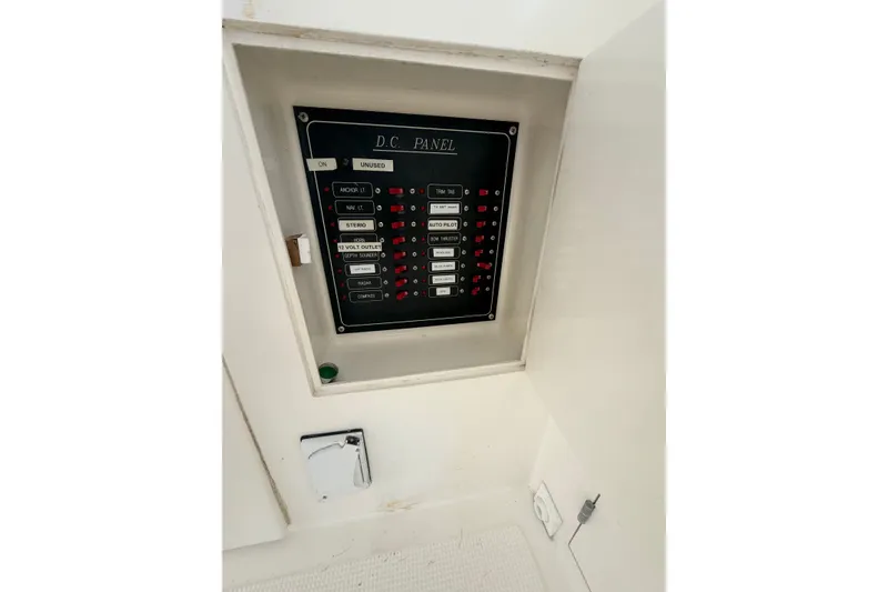 Slide: The Image of Electrical panel on a 2002 Seahorse 45 MY boat, featuring labeled switches and controls. - 11